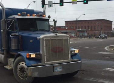 blue truck turning at Fort Smith downtown intersection